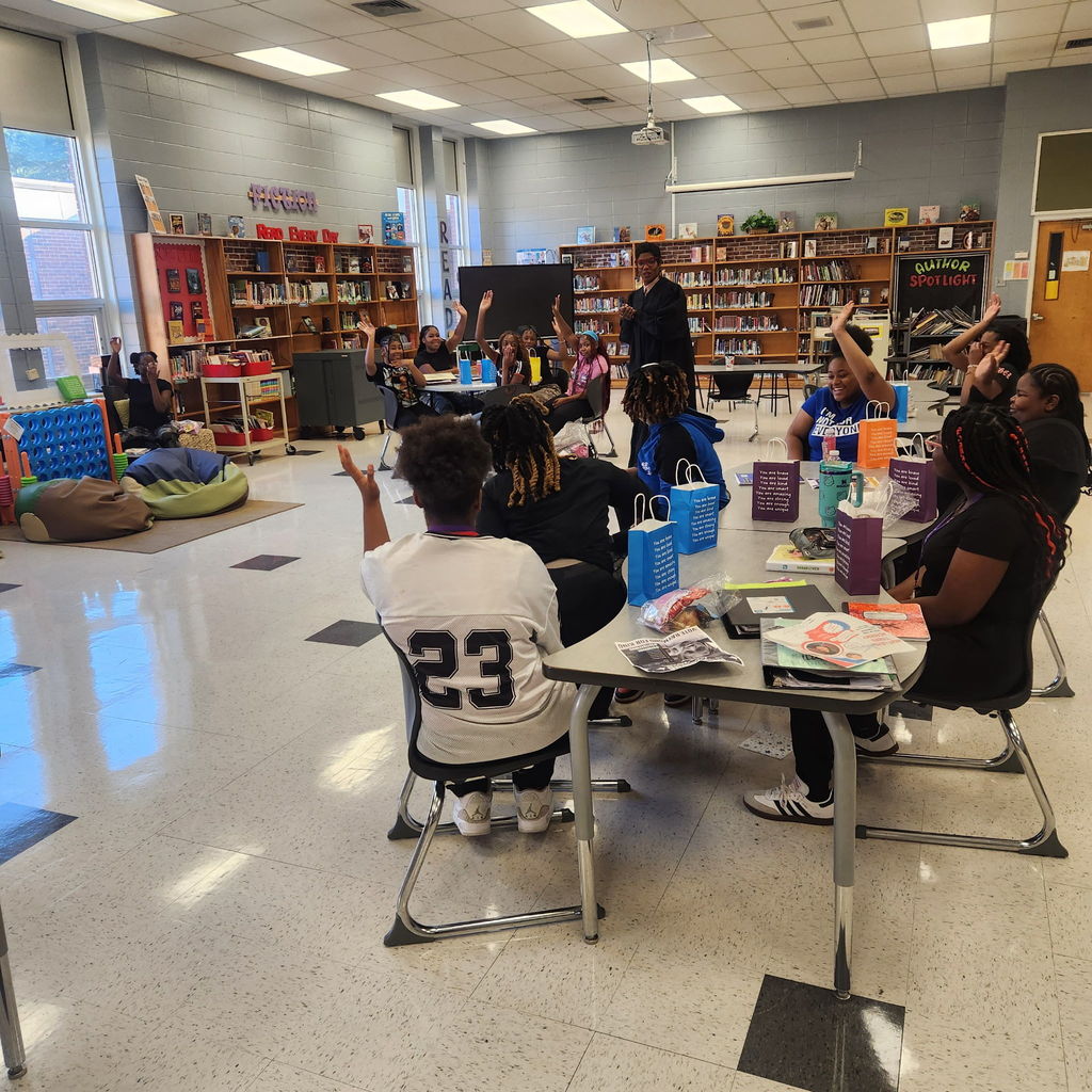 Students participate in discussion.
