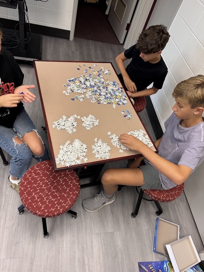 students working puzzle