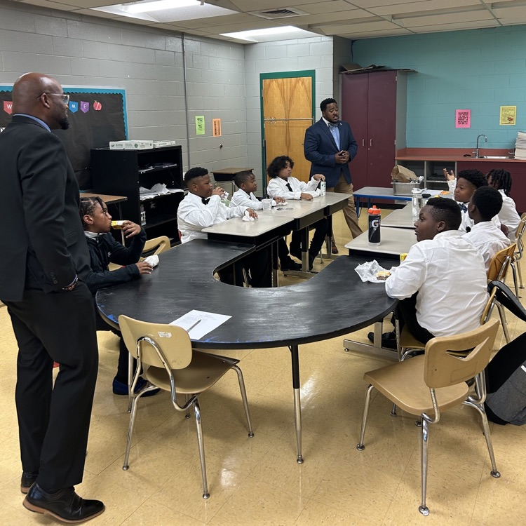 The Kappa Kids listening to two speakers.