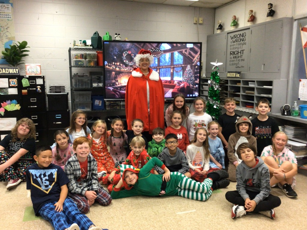 Mrs. Wilson and 4th grade RLC students dressed in Christmas pajamas