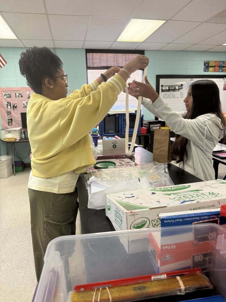 teacher helping student