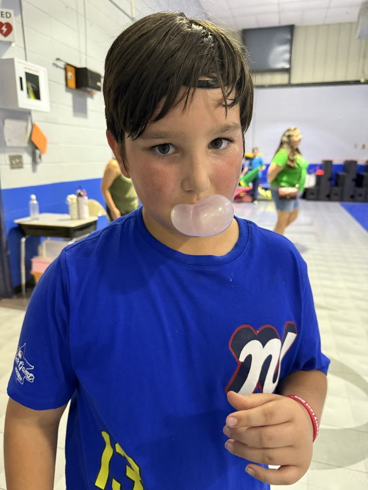 students blowing a bubble 