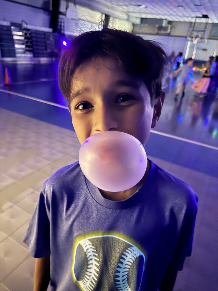 students blowing a bubble 
