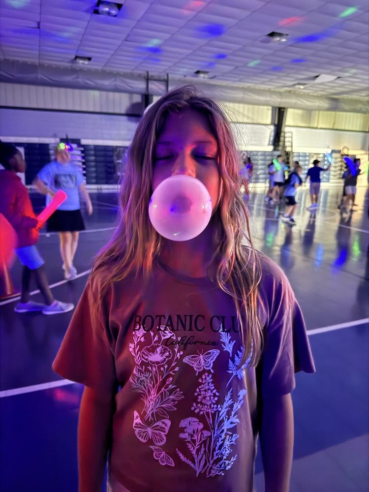 students blowing a bubble 