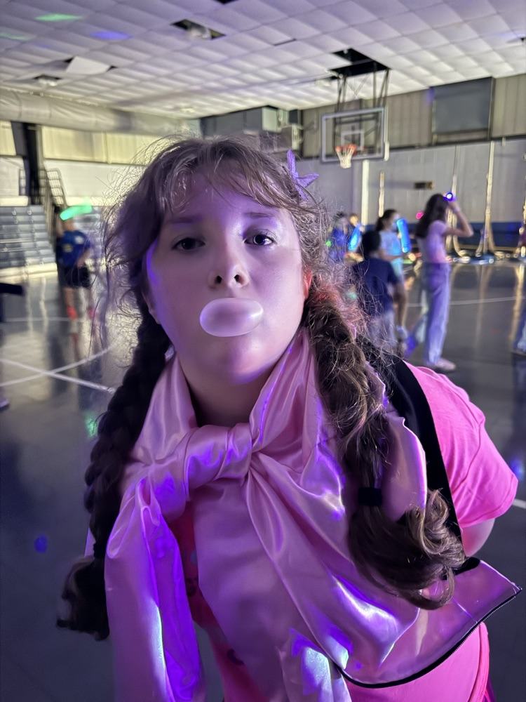 students blowing a bubble 