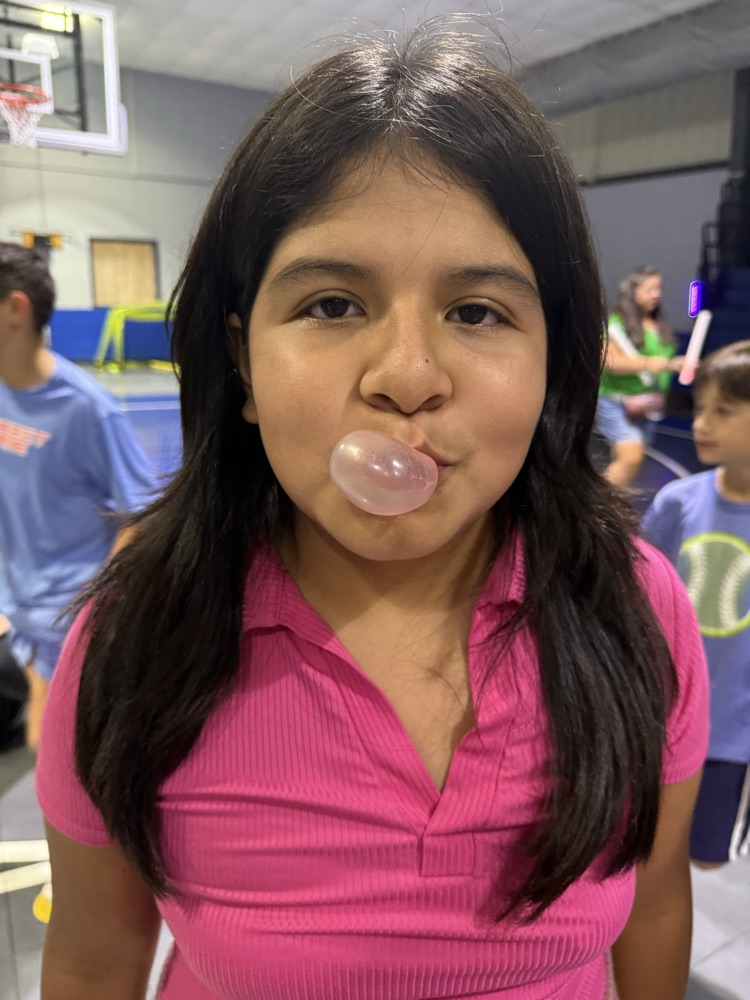 students blowing a bubble 