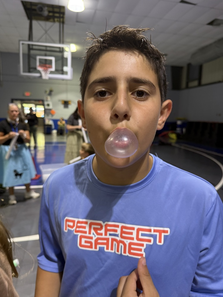 students blowing a bubble 