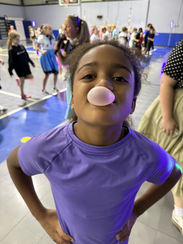 students blowing a bubble 