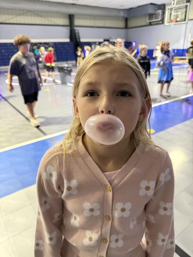 students blowing a bubble 