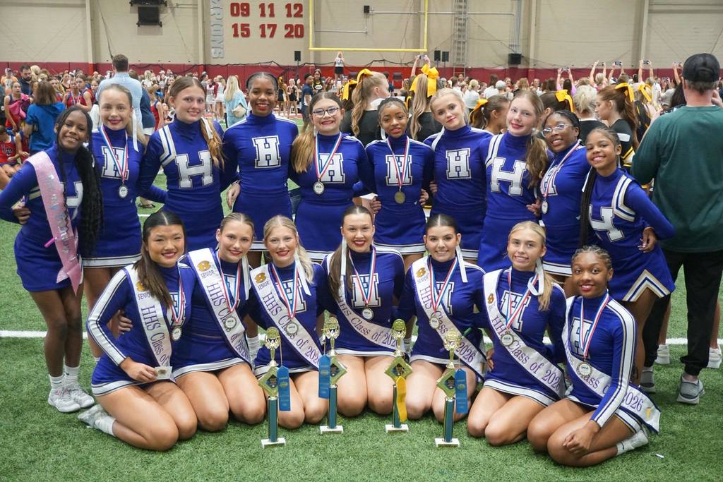 Hueytown High School cheerleaders stand together for a photo.