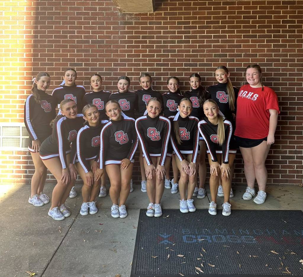 Oak Grove High School cheerleaders stand together for a photo.