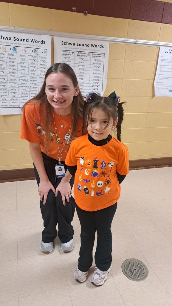 Student and teacher dressed as twins