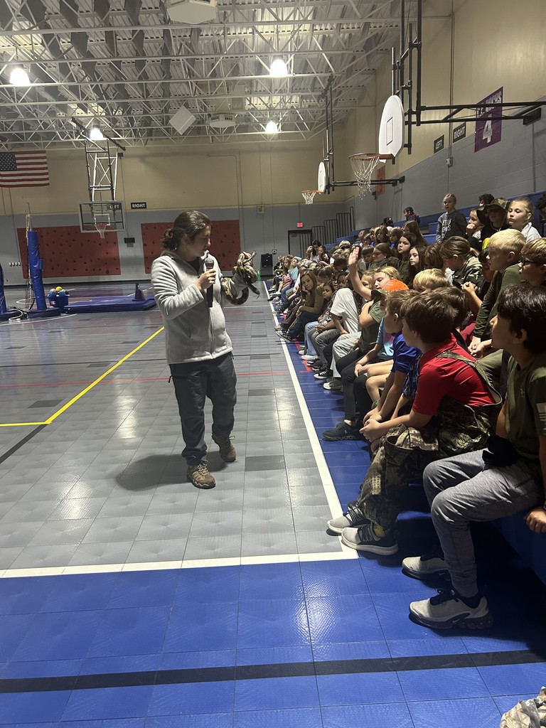 Emily Hutto from Jefferson County Greenway showing students a snake