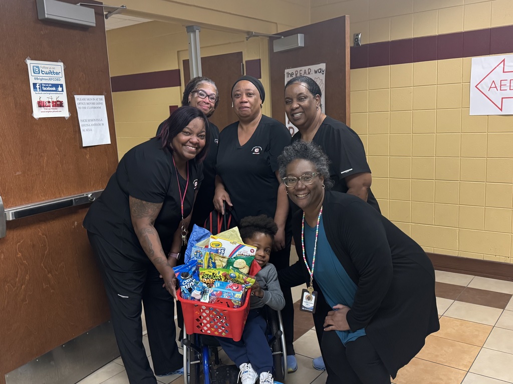 teachers and student holding a gift