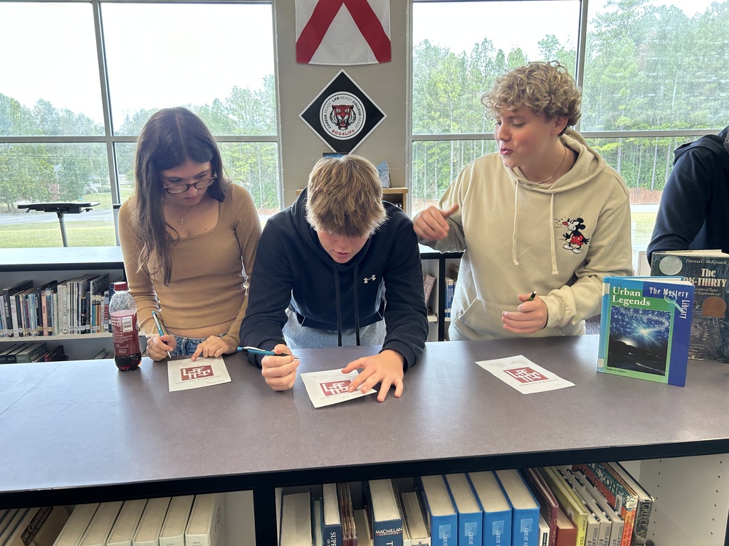 students working on crossword