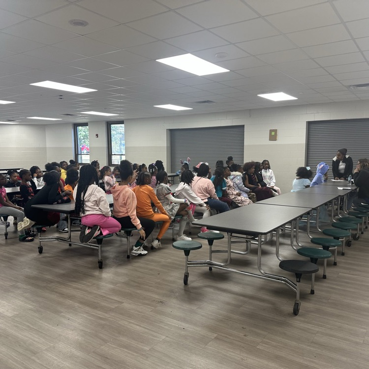 A club listening to instructions.