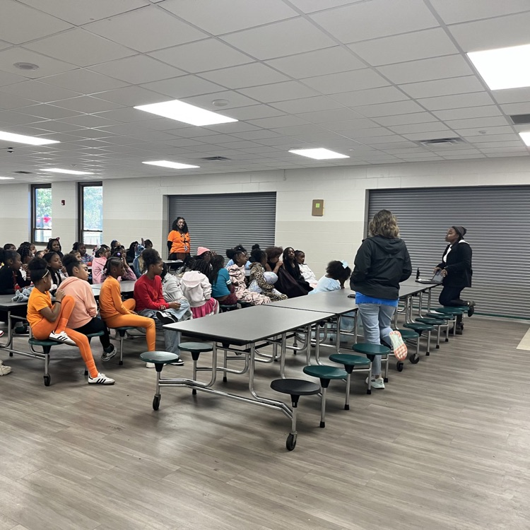 A club listening to instructions.