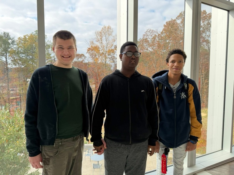 Hueytown students stand together and smile for a photo while touring a hospital.
