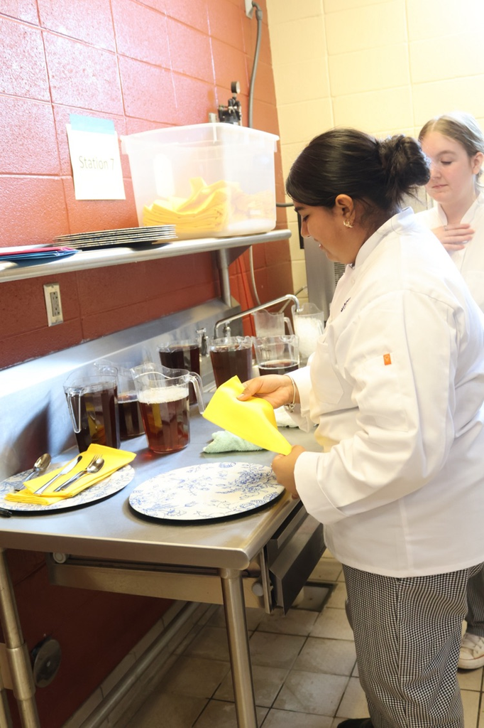 A McAdory High School culinary student prepares a meal.