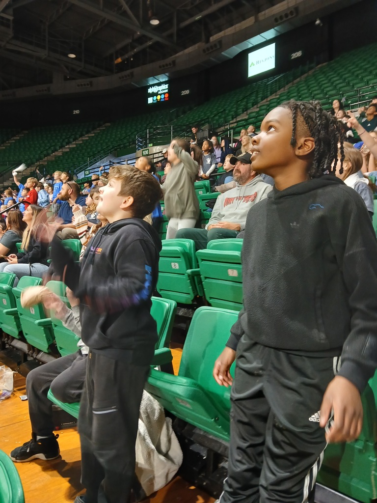 students at basketball game