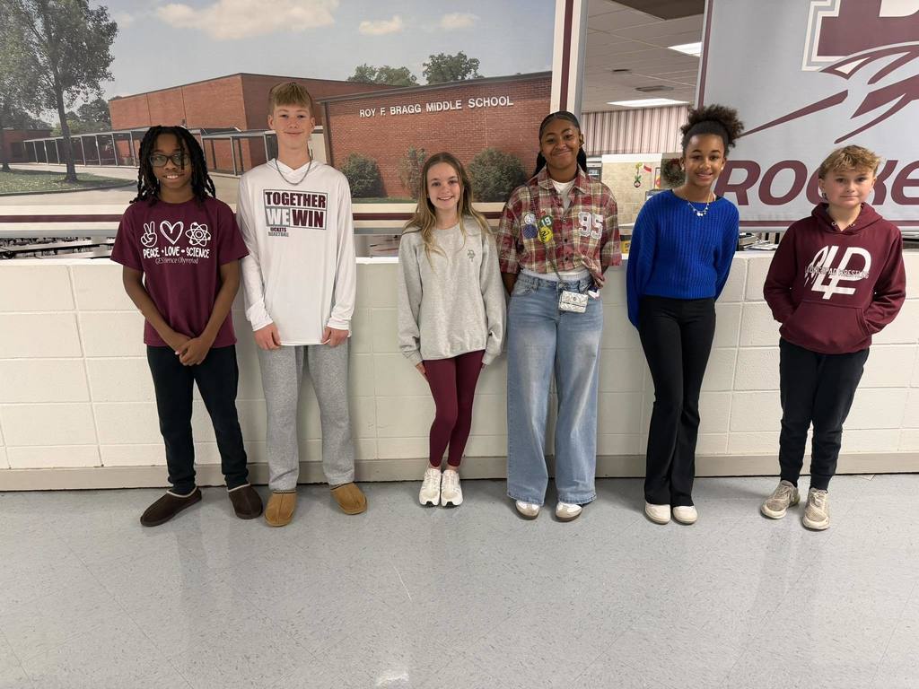 student of the month standing in a row