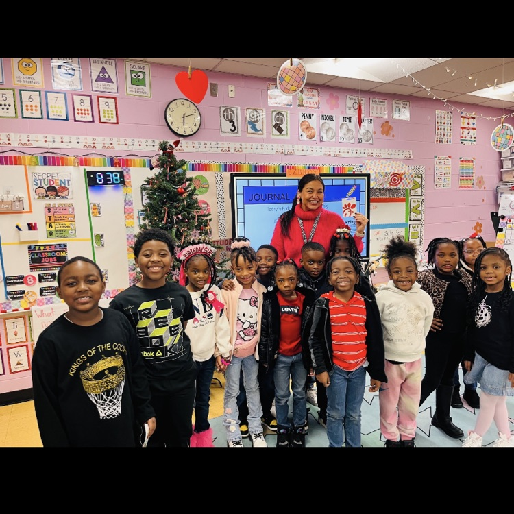 A picture of Ms. Gilreath's class posed for a picture because they won the song of the week.