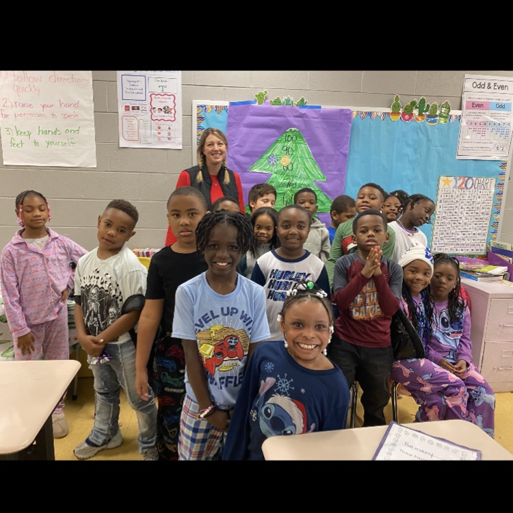 Ms. Flory's class posing with food items for the picture.