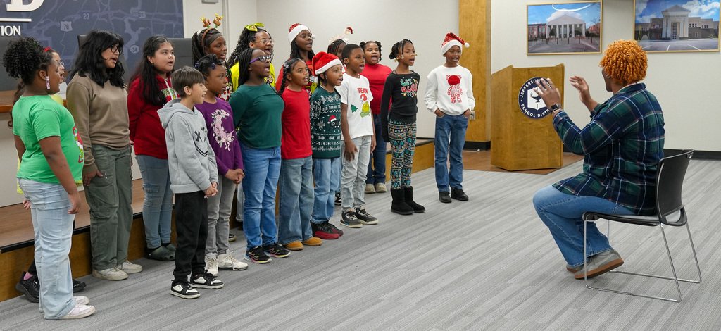 Lipscomb singers perform inside JEFCOED board room.