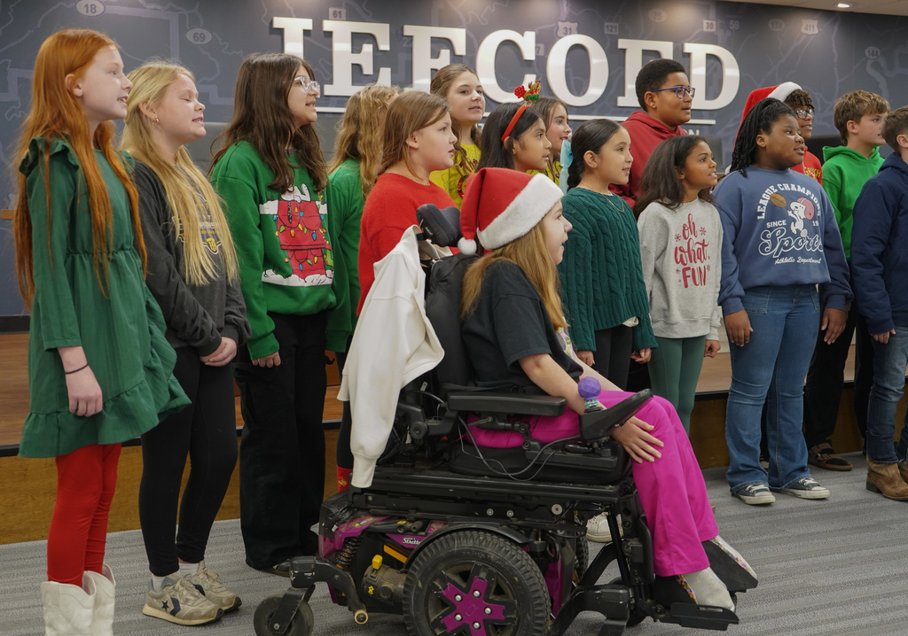 Concord Singers perform inside JEFCOED board room.