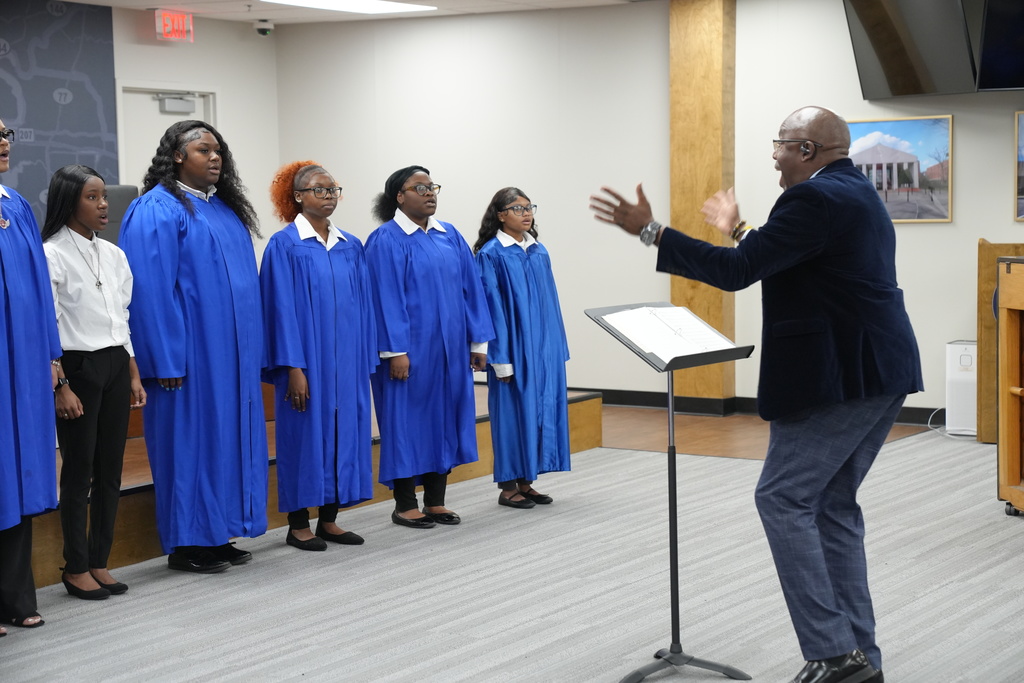 Center Point High School Chorale performs inside JEFCOED board room.