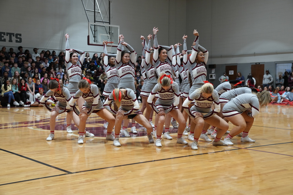 Image is from the Bragg Middle School Christmas Visions Pep Rally inside Bragg's gym. In the photo, Gardendale cheerleaders are performing a routine.