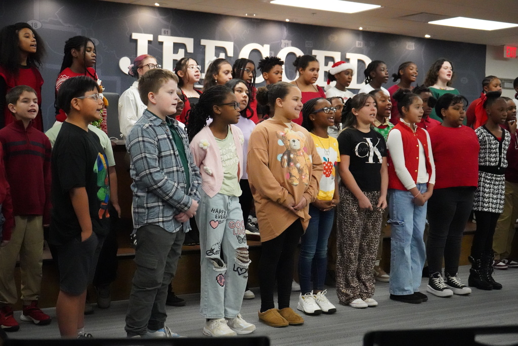 Choir students from Grantswood Community School and Irondale Community School perform together in the board room at the Jefferson County Schools Board of Education.