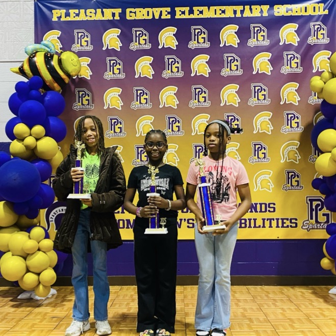 A picture of the three winners in the Spelling Bee.