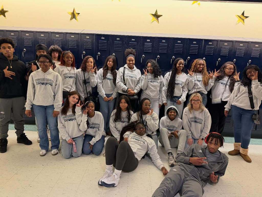 Clay-Chalkville High School students stand together for a photo inside a school hallway.