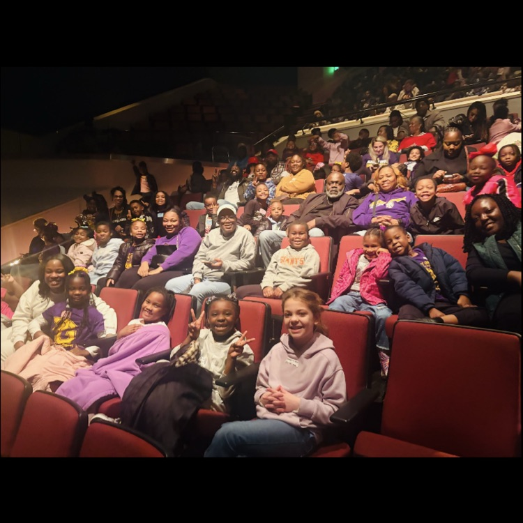 First grade students sitting in the theater.