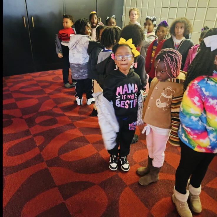 Students waiting in line to go into the theater.