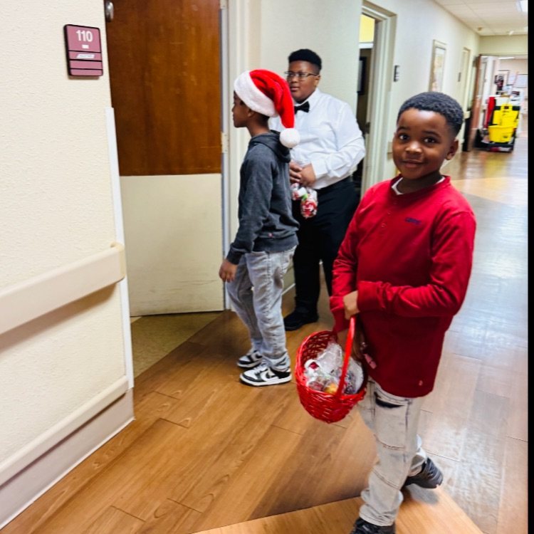 Kappa Kids handing out toiletries to patients at the Legacy Rehabilitation Center.