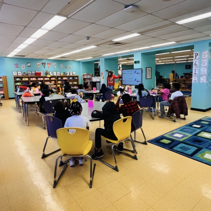 Students learning how to make far flying airplanes during Club Day.