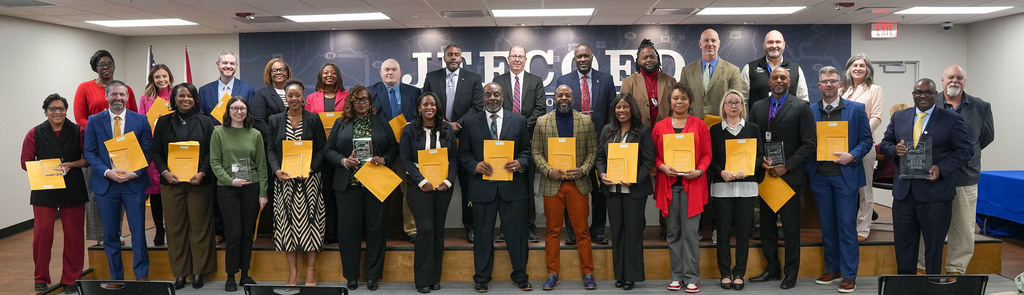 JEFCOED principals with schools that received the Energy Star award stand together for a photo with Superintendent Dr. Gonsoulin and representatives from Cenergistic in the JEFCOED board room.