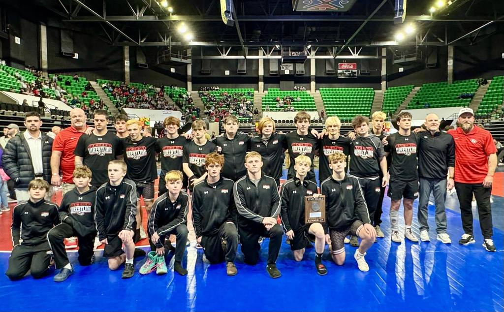 Oak Grove High School's varsity wrestling team and coaches pose for a photo with their trophy after coming in second at the 2026 AHSAA Wrestling Duals.