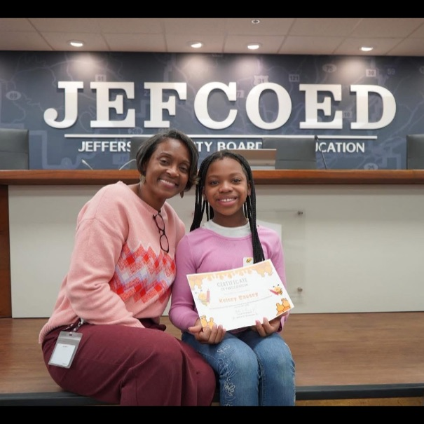 Kelsey posing with her Finalist certificate.