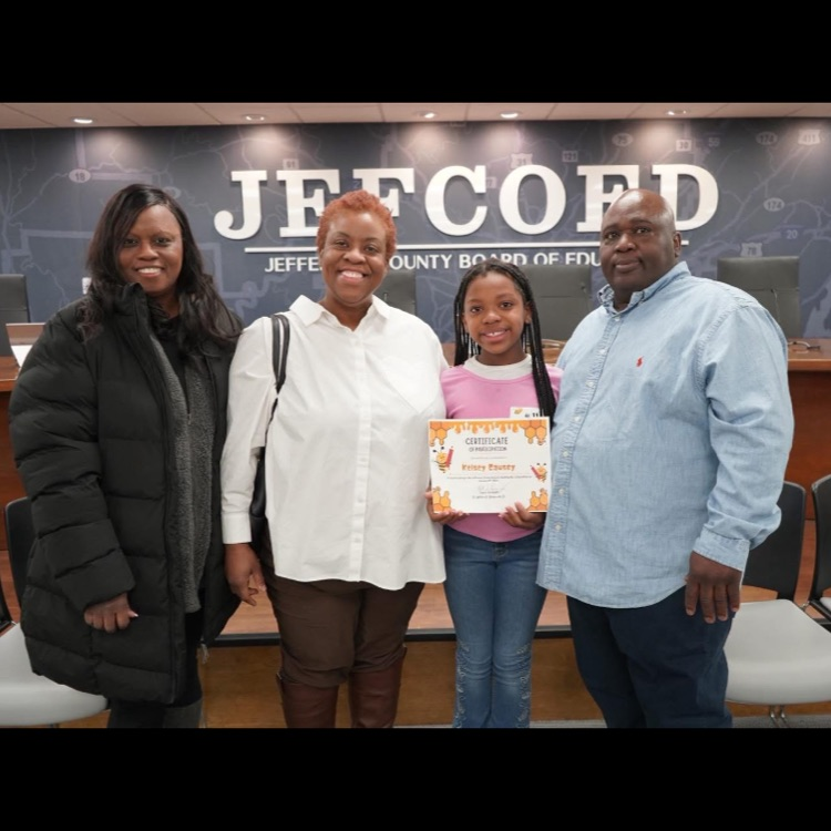 Kelsey posing with her family after finishing the Jefferson County Spelling Bee.