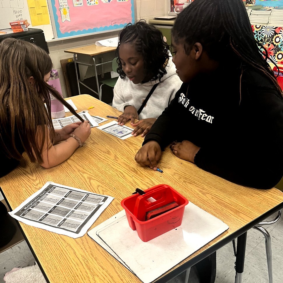 Students playing the math game