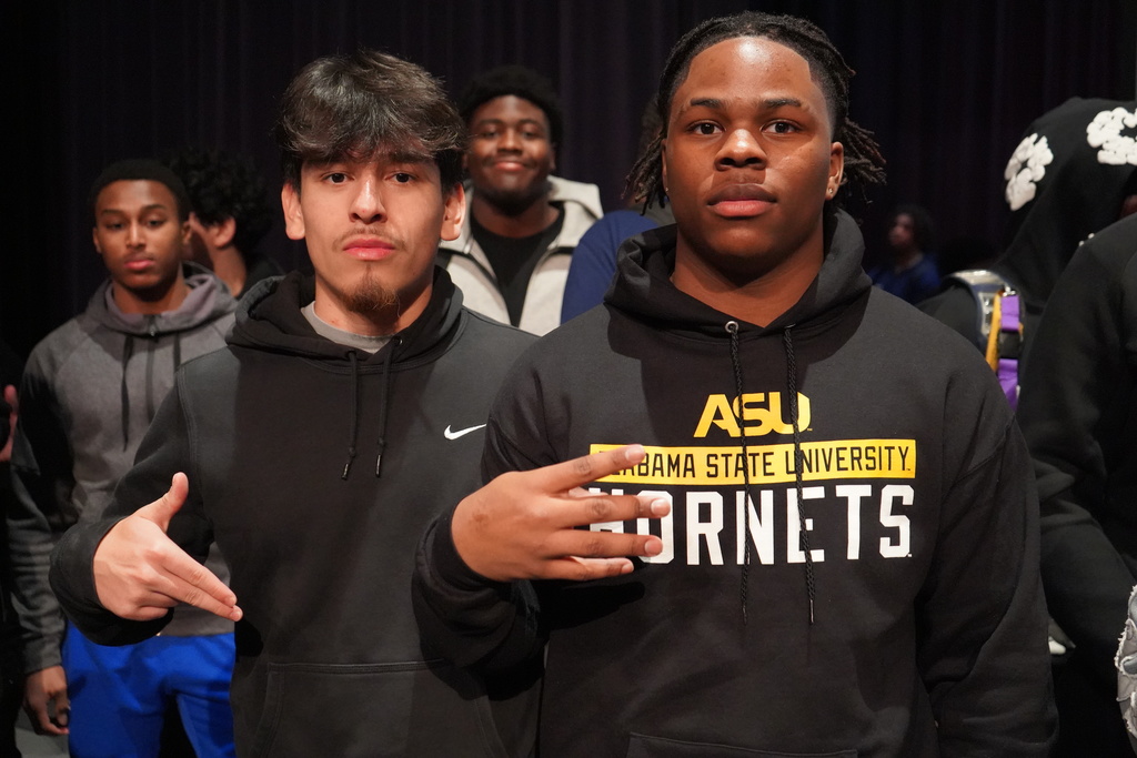 Clay-Chalkville High School student Joshua Woods poses for a photo with another student following Clay-Chalkville High School's National Signing Day Ceremony.