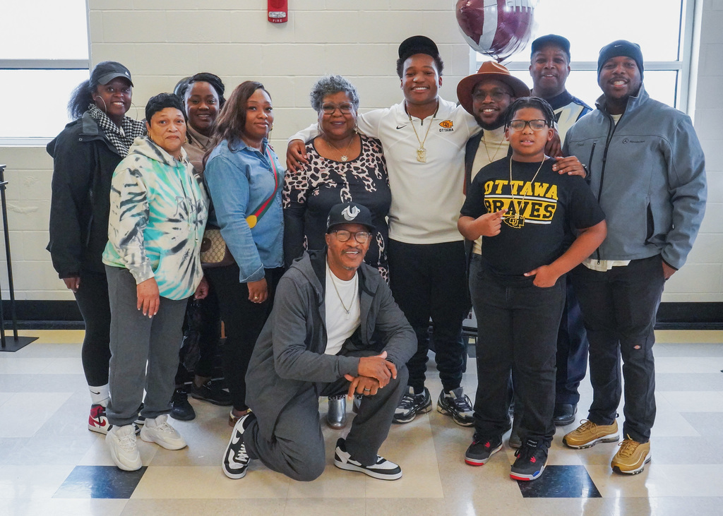 A large family poses for a picture on National Signing Day at McAdory High School. 
