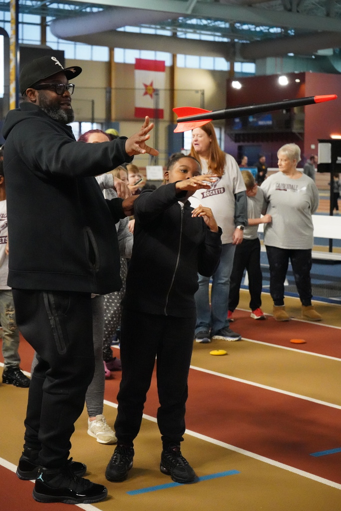 A student throws a javelin at the Elementary ExEd Track and Field day at the Birmingham Crossplex.