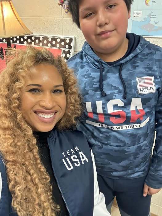 student and teacher smiling