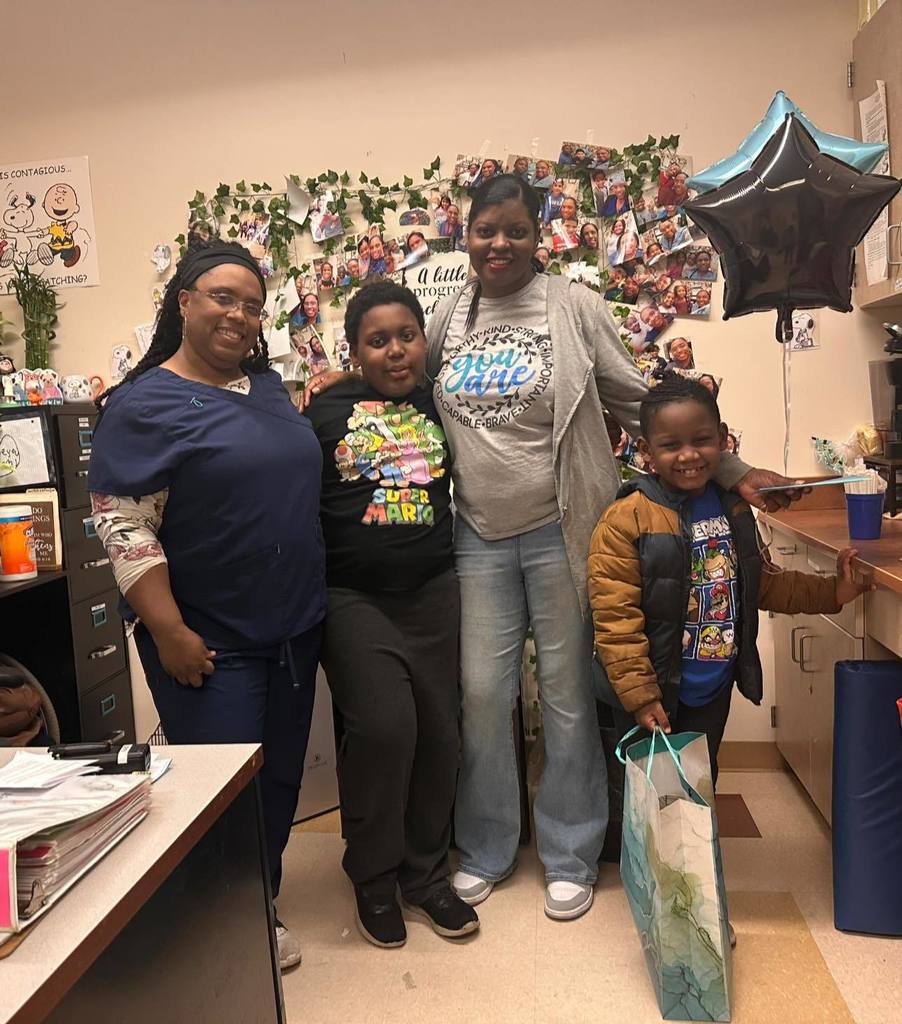 teacher and students smiling