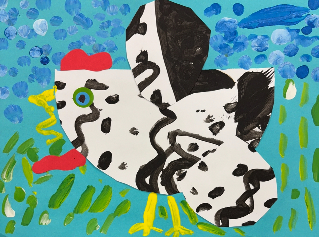 Picture of a chicken made using paint and paper. The chicken is black and white on top of a blue background with dots of paint on it.