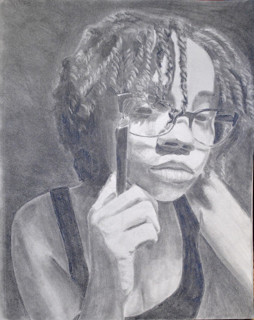 A self-portrait of a girl with glasses holding an object in her hand. The portrait was made using graphite.